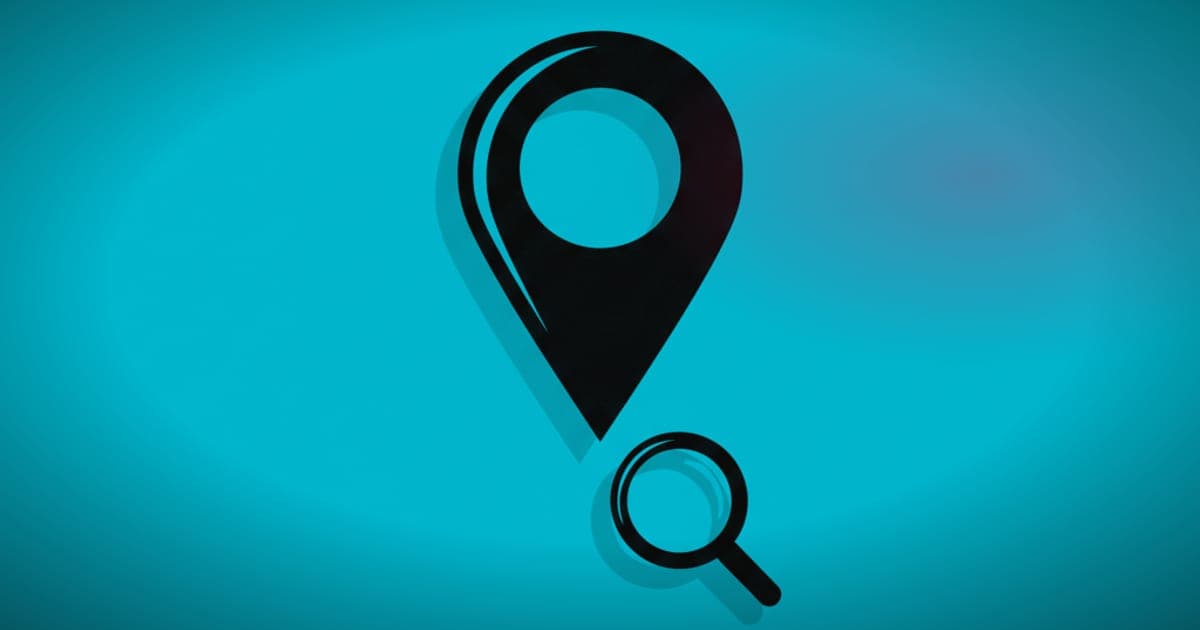 A location pin overlapping a magnifying glass, symbolizing local SEO search and comparison.