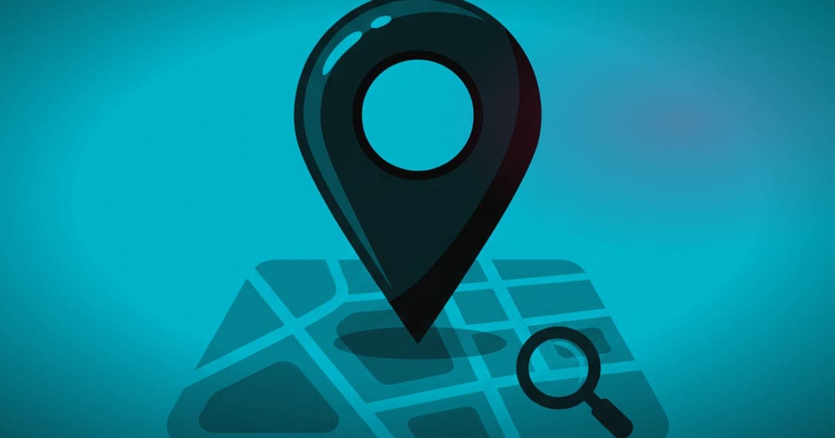 A location pin on a map with a magnifying glass